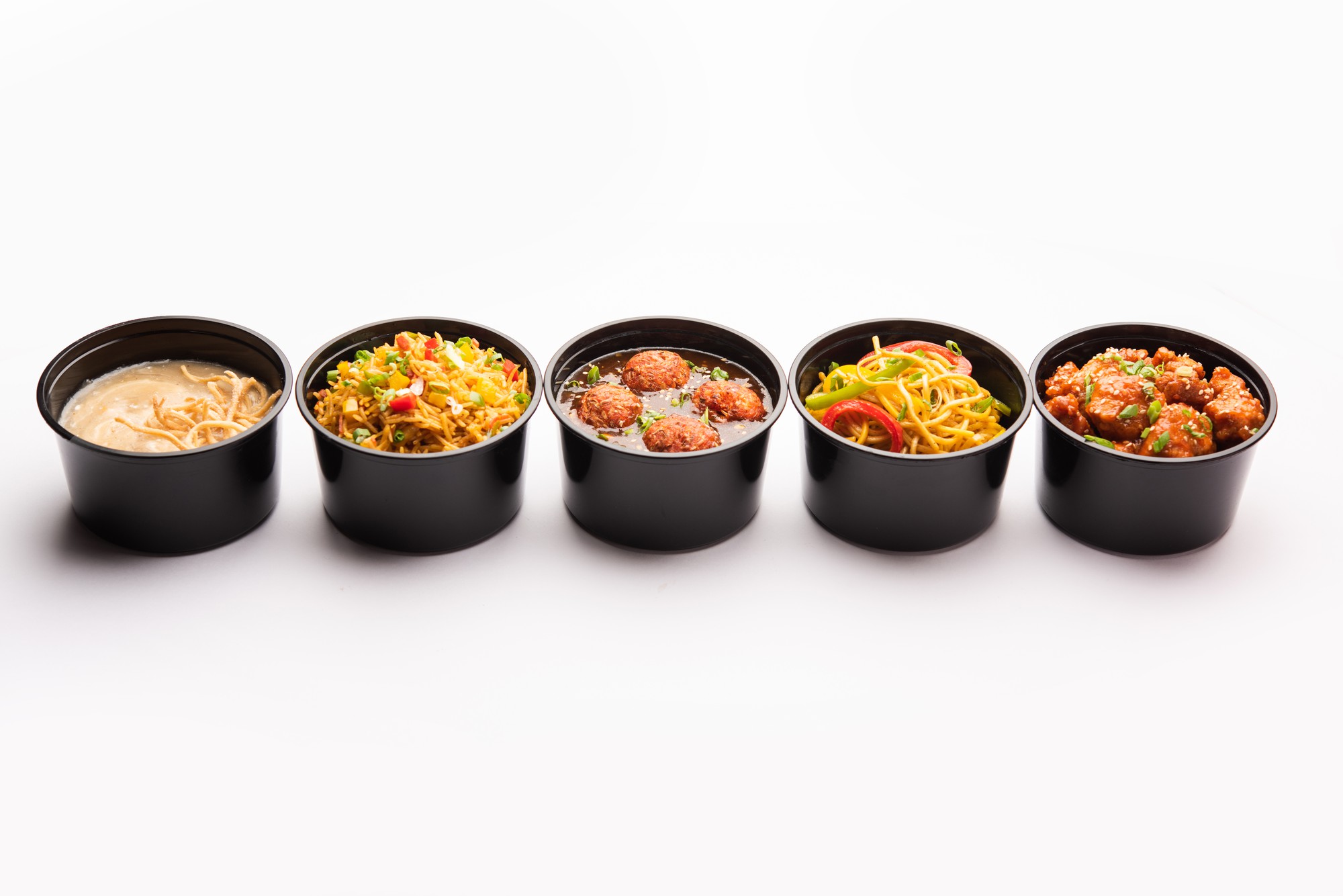 Stack of prepared meal bowls ready to serve