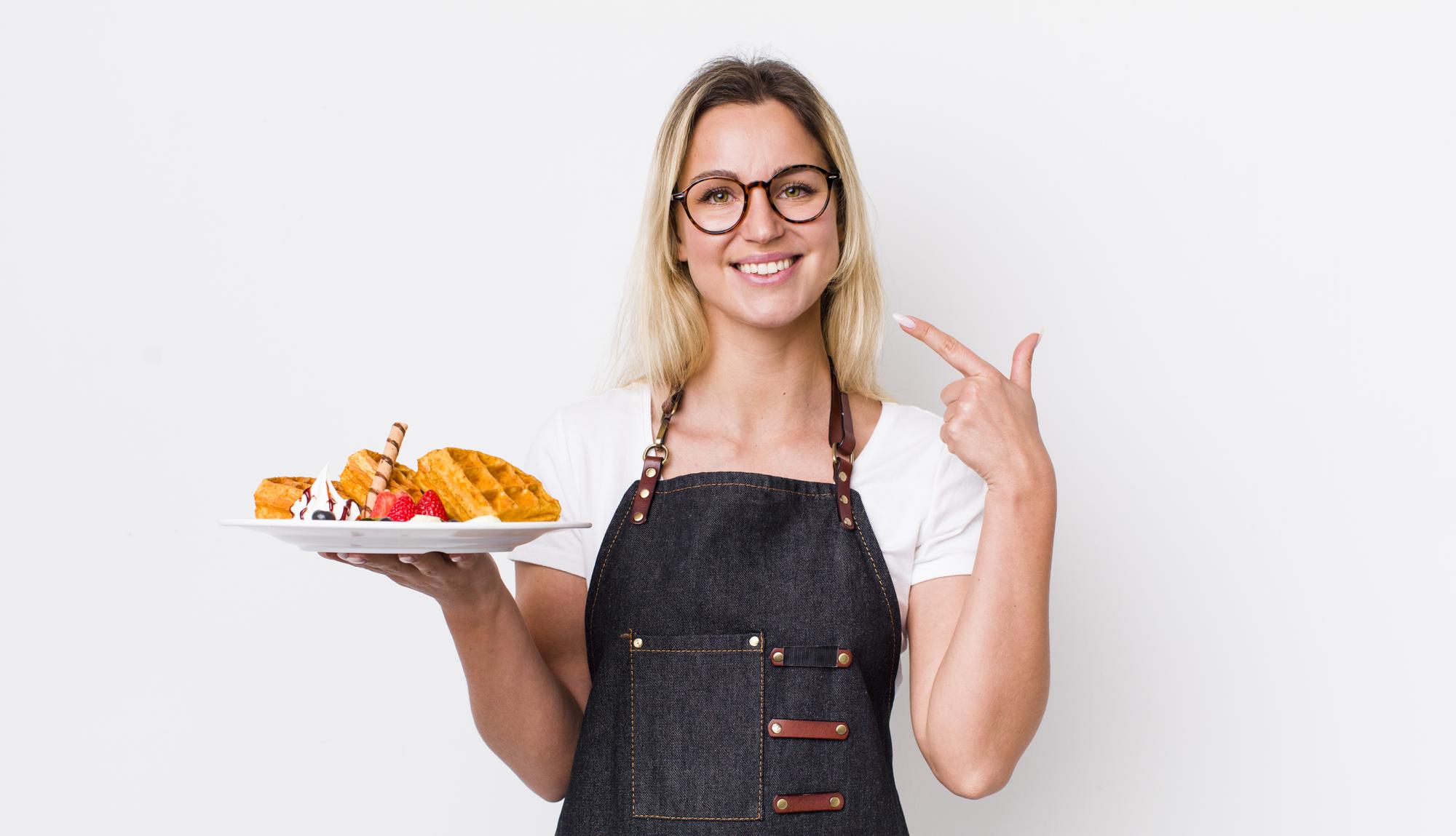 Friendly chef offering a prepared meal